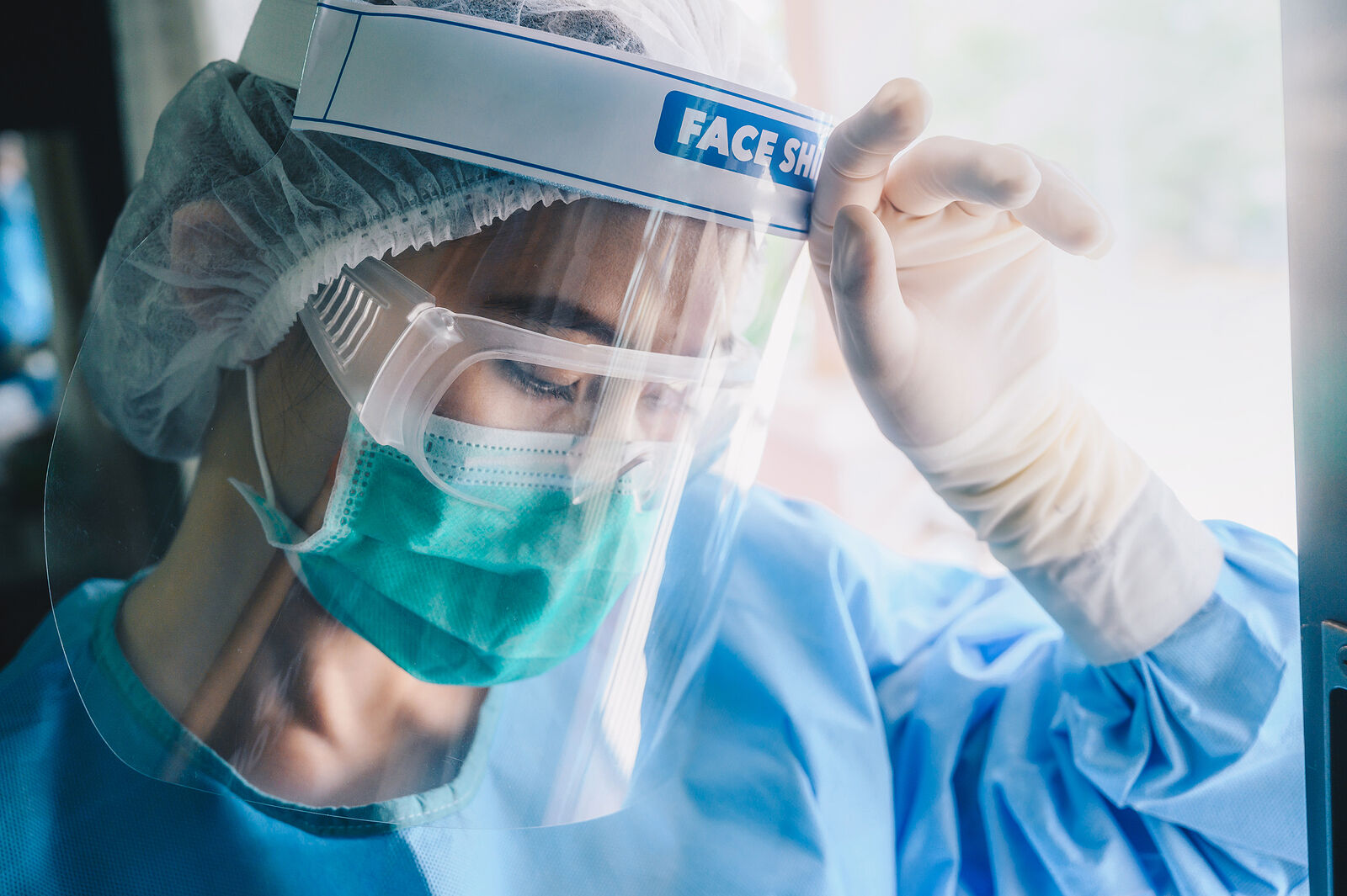 Nurse Having Headache And Tired From Work While Wearing Ppe Suit For Protect Coronavirus Disease. Th